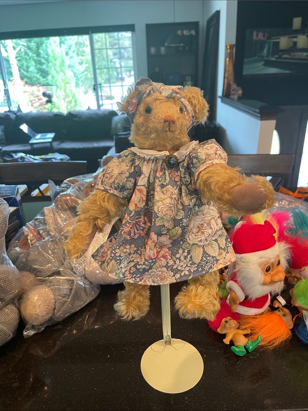 13” artist mohair bear with dress and pennant.